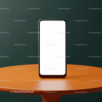 Modern smartphone with blank screen on orange table