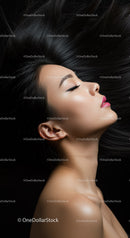 Profile of woman with flowing black hair and serene expression