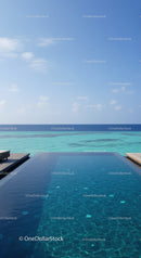 Luxury Infinity Pool Overlooking Turquoise Ocean and Clear Blue Sky
