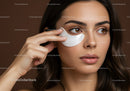 Close-up of Woman Applying Under-Eye Skin Care Mask for Youthful Skin