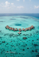 Overwater Bungalows in Turquoise Lagoon Surrounded by Coral Reef