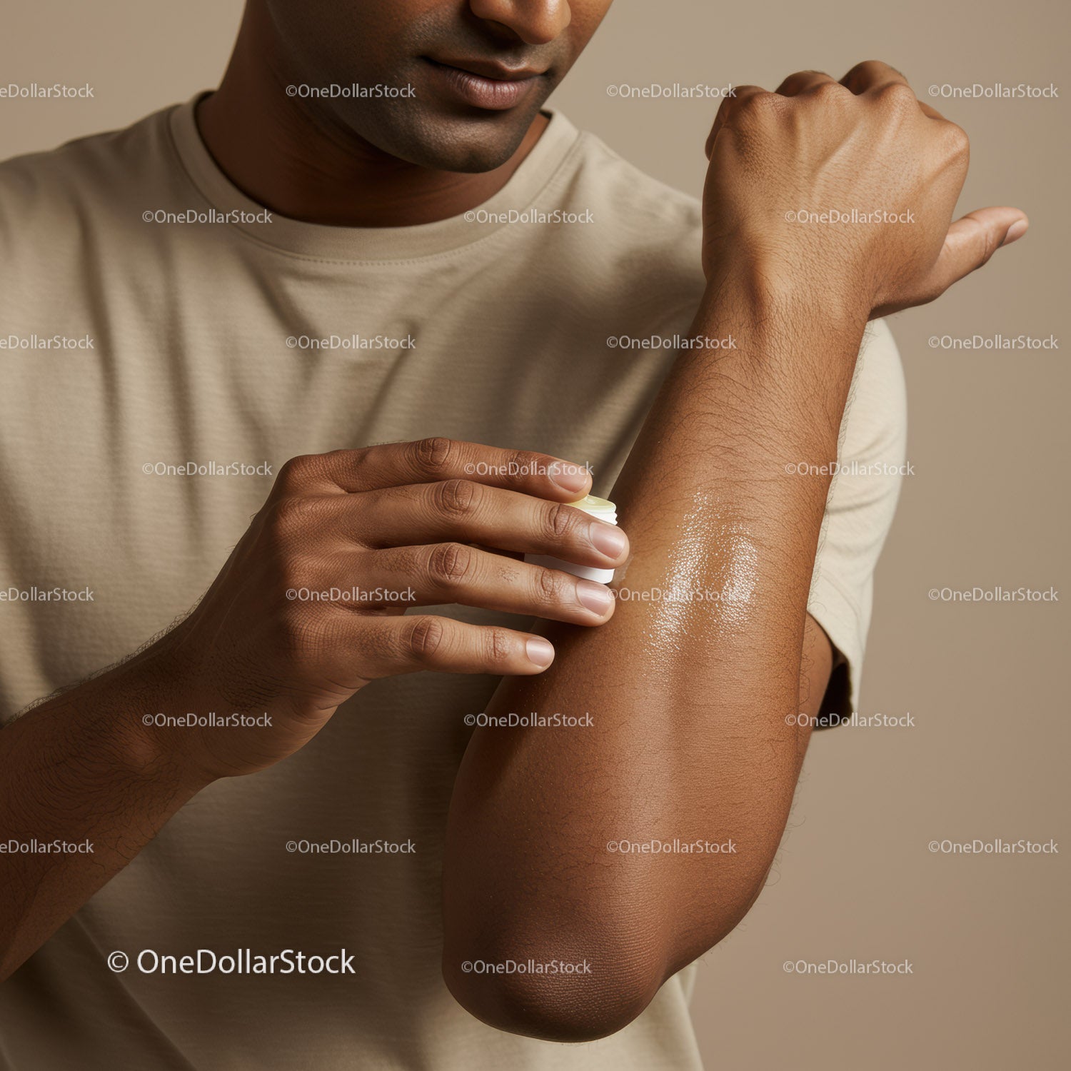 Man Applying Lotion to Arm for Skin Hydration and Care