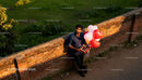 Man Holding Heart Balloons and Chocolates Outdoors