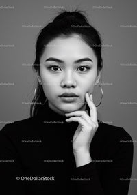 Elegant Black and White Portrait of a Woman with Hoop Earrings