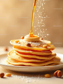 Stack of golden pancakes with butter and syrup drizzle