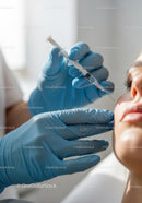Medical Professional Administering Vaccine Shot to Patient in Clinic