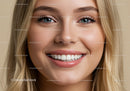 Close-up of smiling young woman with clear skin