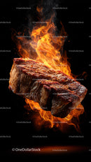 Juicy Grilled Steak with Flames for a fiery culinary visual