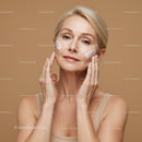 Elegant Mature Woman Applying Skincare Cream for Healthy Skin