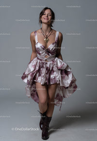 Charming Woman in Floral Dress Wearing Boots Posing Confidently