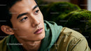 Thoughtful young man in casual green jacket