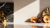 Decorative dried fruit and golden vase on marble surface