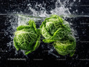 Fresh Green Cabbage in Water Splash with Leafy Greens and Organic Vibe
