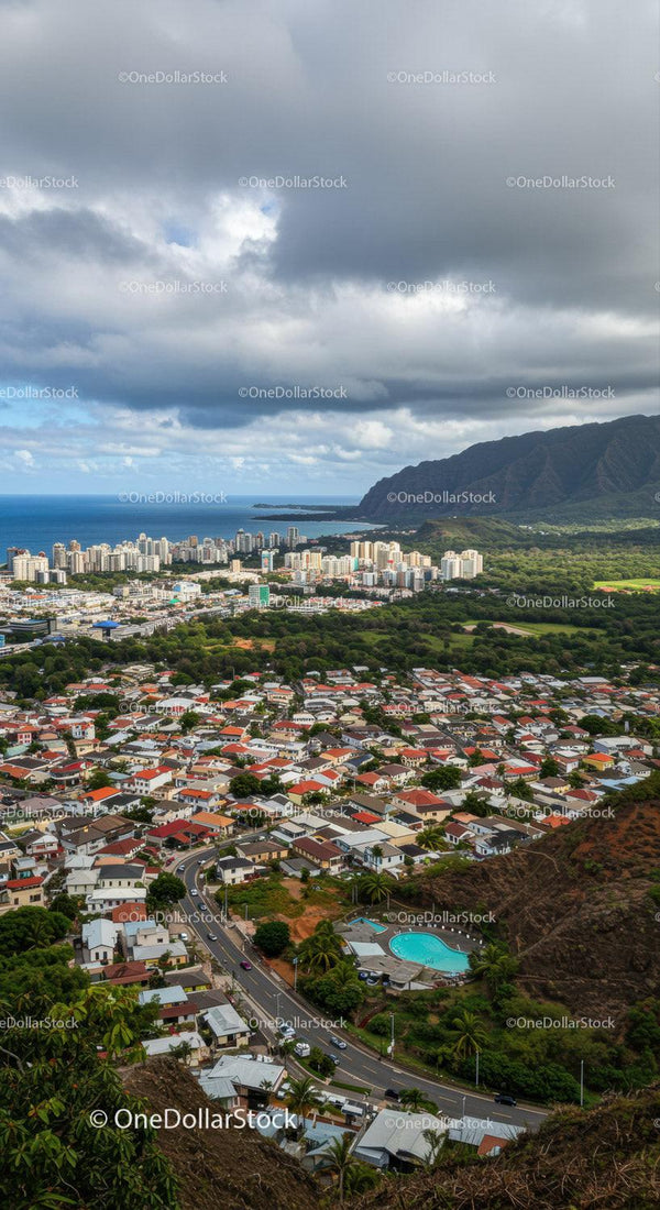 Panoramic View of Coastal City with Mountains and Ocean in Background