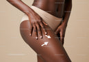 Close-up of an African American Woman in Beige Shorts Touching Her Thigh