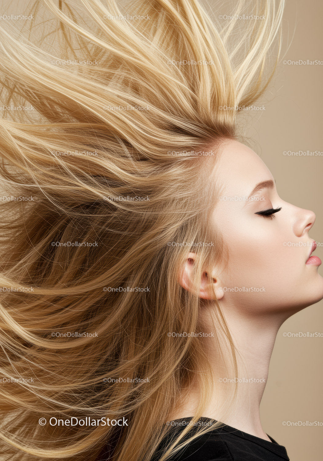Blonde woman with flowing hair and calm expression