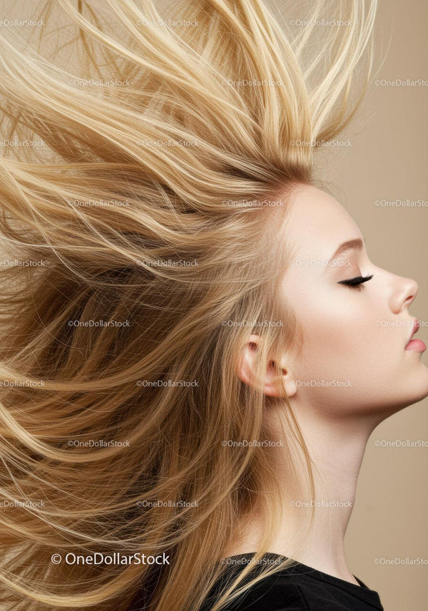 Blonde woman with flowing hair and calm expression