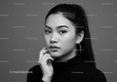 Elegant Black and White Portrait of a Stylish Woman with Earrings