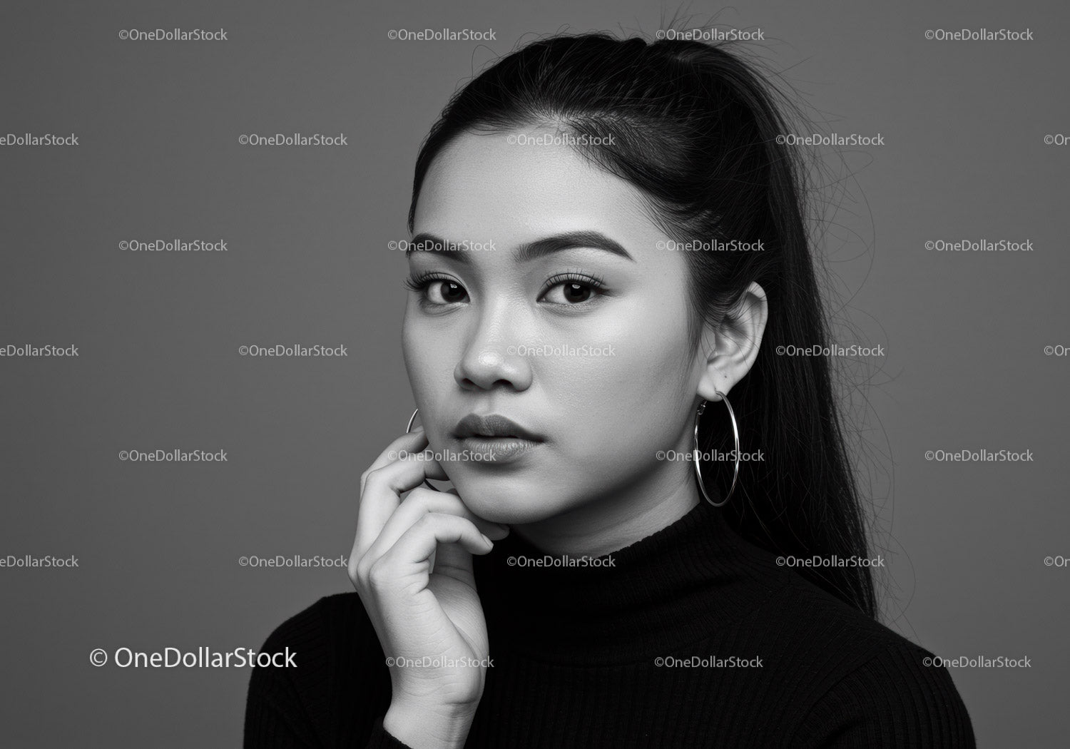 Elegant Black and White Portrait of a Stylish Woman with Earrings