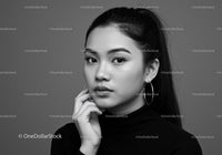 Elegant Black and White Portrait of a Stylish Woman with Earrings