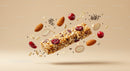 Healthy granola bar with almonds and cranberries floating
