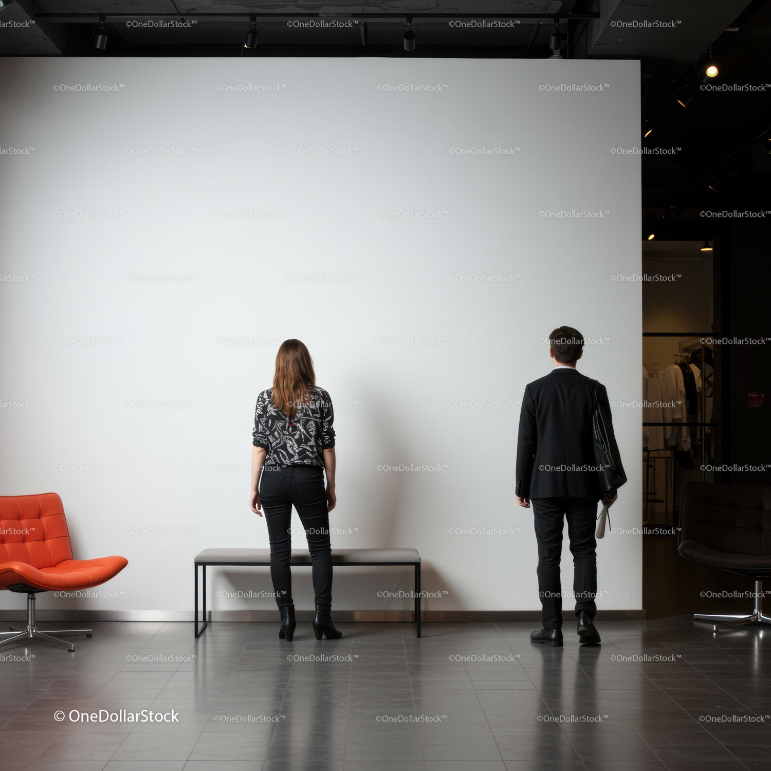 Two people admiring blank white gallery wall indoors