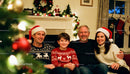 Family smiling together in cozy Christmas living room