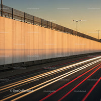 City Highway with Light Trails During Sunset in Urban Environment