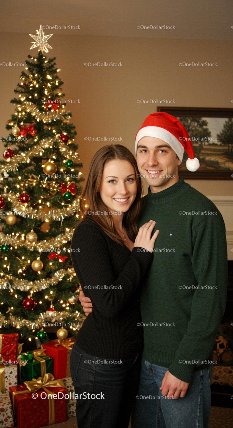 Couple Smiling Together by Festive Christmas Tree