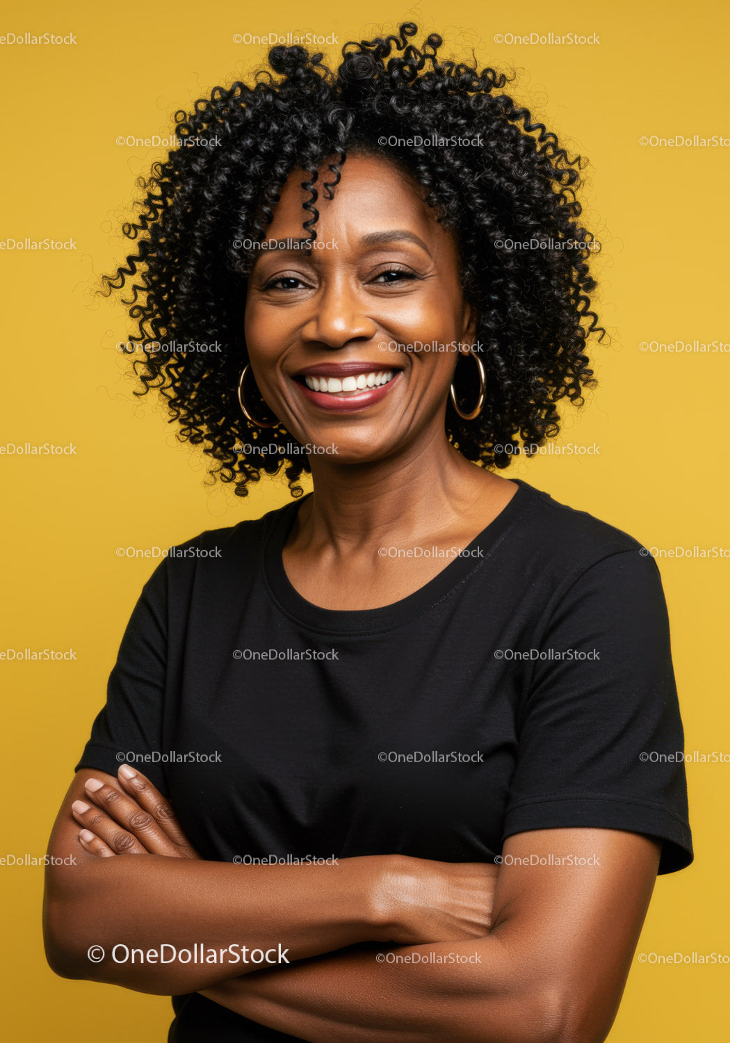Confident Smiling Woman with Curly Hair Crosses Arms Against Bright Yellow Background