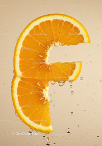 Fresh orange slices dripping with water droplets