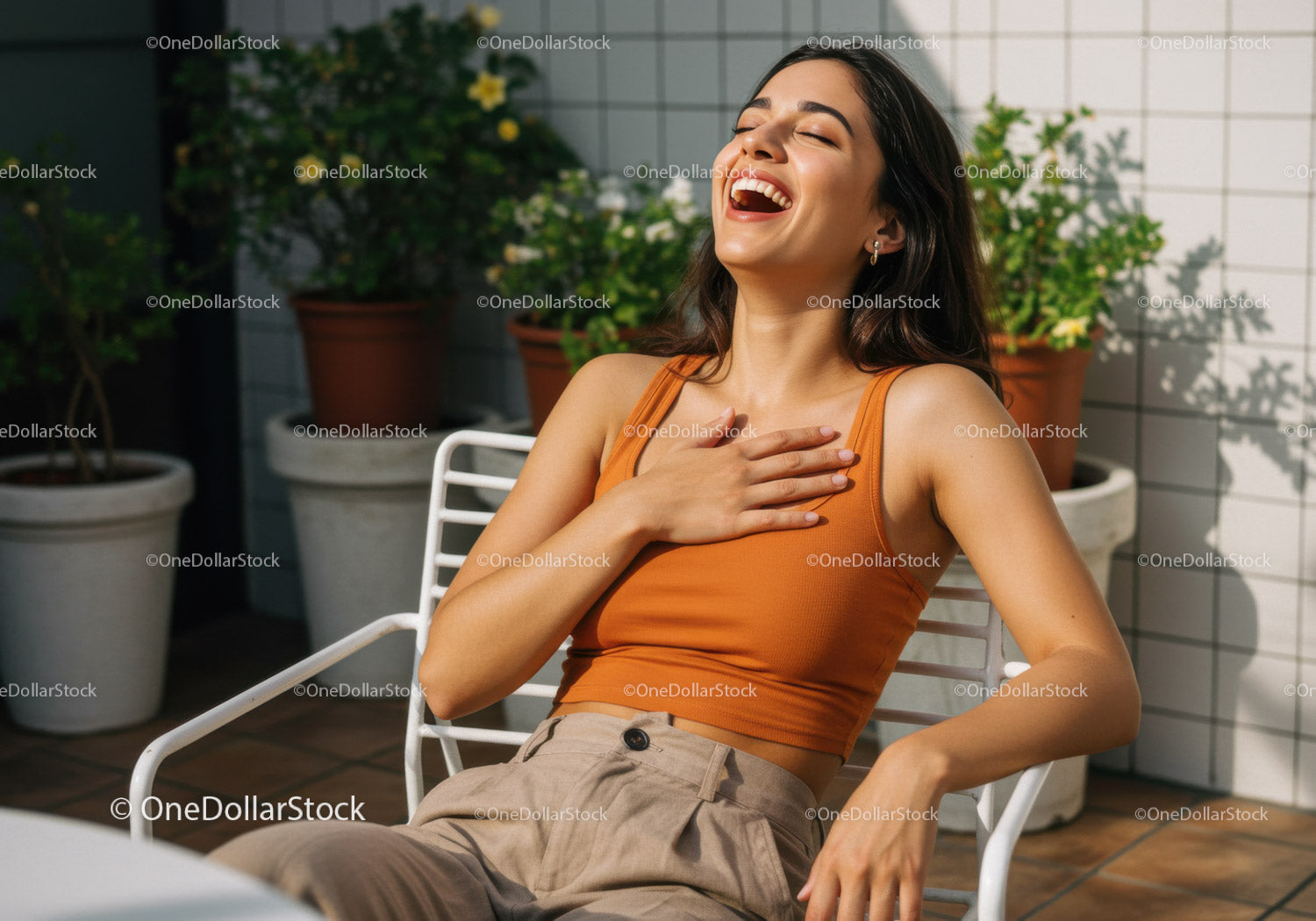 Cheerful Woman Laughing Outdoors in Sunny Patio amidst Greenery