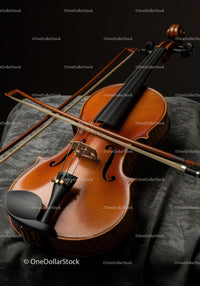 Elegant Wooden Violin with Bow on Black Velvet Surface