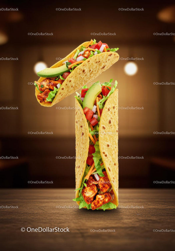 Grilled chicken tacos with fresh vegetables on wooden table