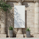 Blank Vertical Banner Between Classical Stone Columns Outdoors