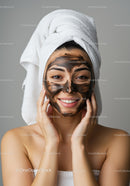 Young Woman Relaxing During Facial Mask Application