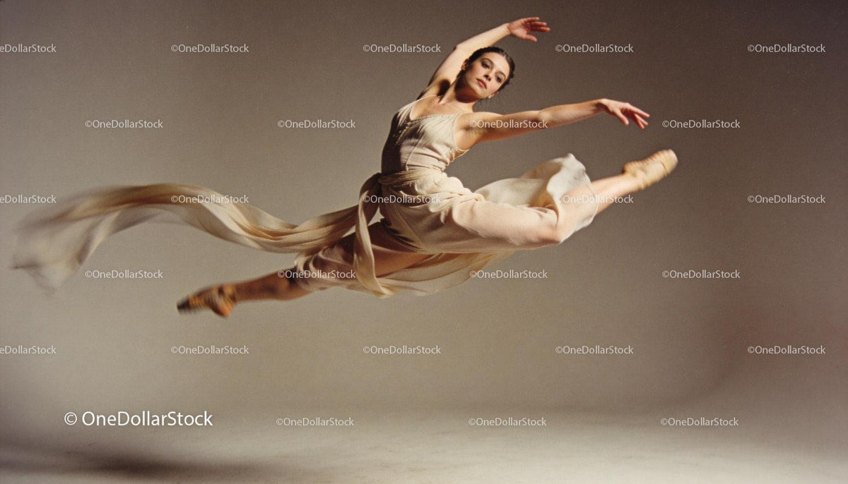 Graceful ballet dancer performing an elegant leap