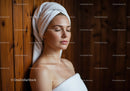 Relaxing Woman with Towel Wrap in Spa Setting