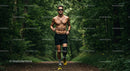 Male Runner with Prosthetic Leg Running Through Foggy Forest Trail