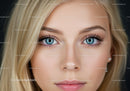 Close-up portrait of young woman with blue eyes