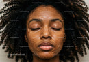 Close-up of African American Woman with Facial Mask Relaxing Spa Treatment