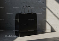 Minimalist black shopping bag on concrete floor light