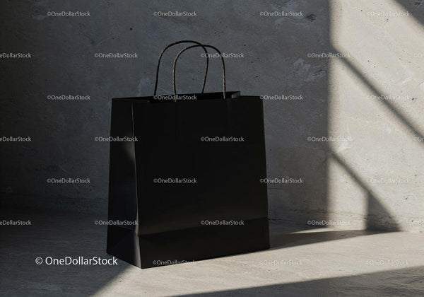Minimalist black shopping bag on concrete floor light JPG Mockup Image