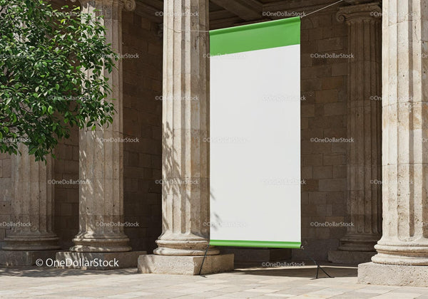 Blank banner displayed between stone columns outdoors JPG Mockup Image
