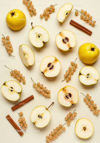 Fresh quince fruits with cinnamon and white currants on beige