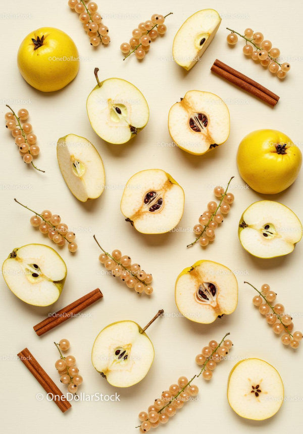 Fresh quince fruits with cinnamon and white currants on beige