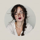 Young Woman with Freckles and Dark Red Lipstick in Joyful Portrait