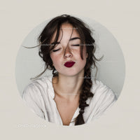 Young Woman with Freckles and Dark Red Lipstick in Joyful Portrait