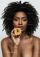 Portrait of Beautiful Woman Holding Passion Fruit with Curly Hair
