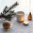 Minimalist Holiday Decor with Candle and Pine Branch